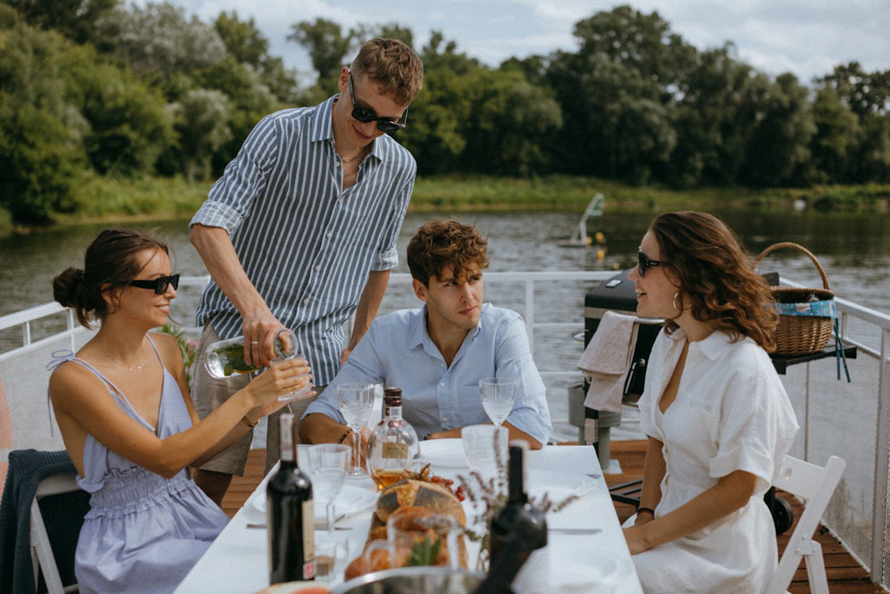 Ultimate Guide to Summer Wine Subscription Gifts (Bank Holiday Special) 2 Friends enjoying a bank holiday barbecue with red and white wines